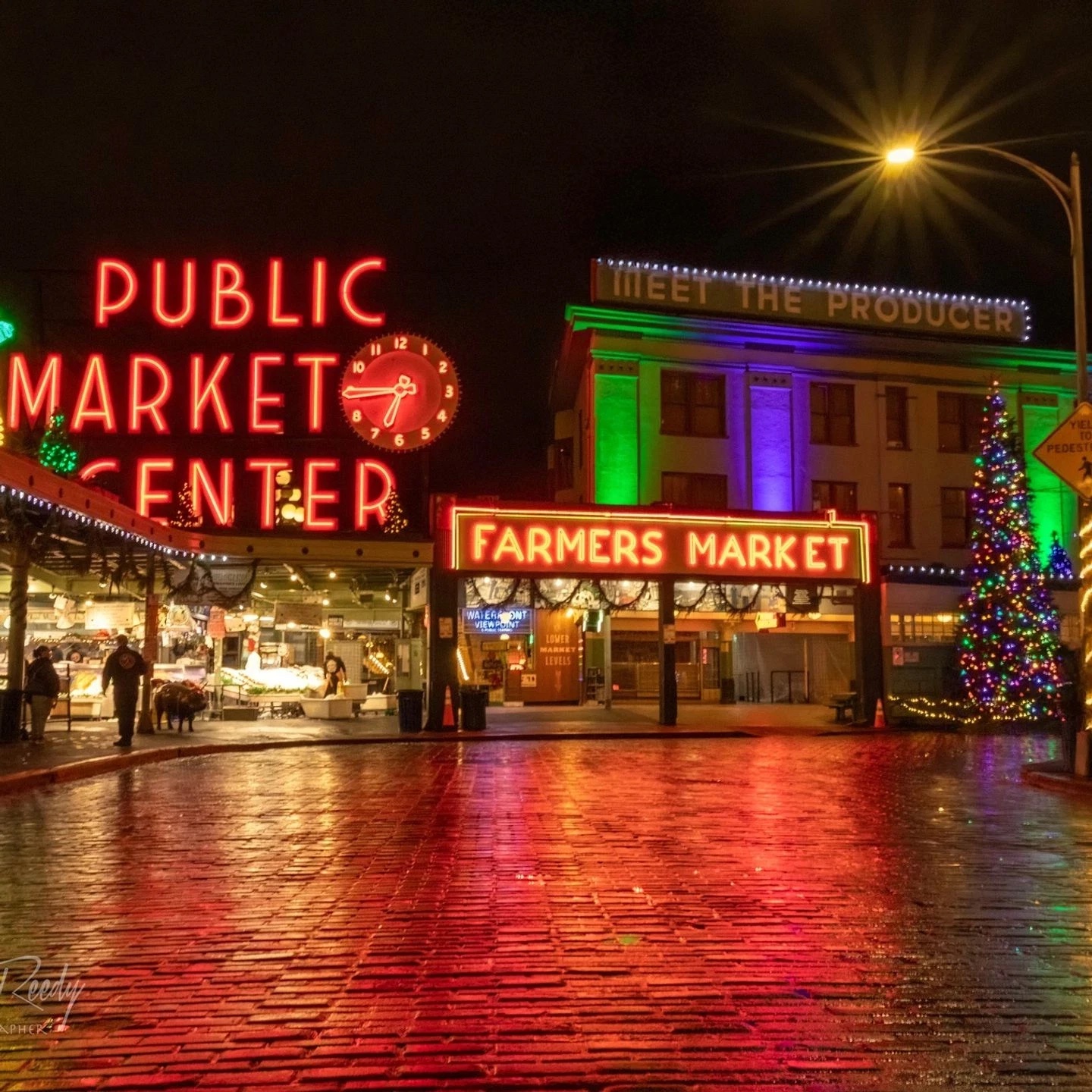 Pike Place Public Market Center neon sign at night Seattle