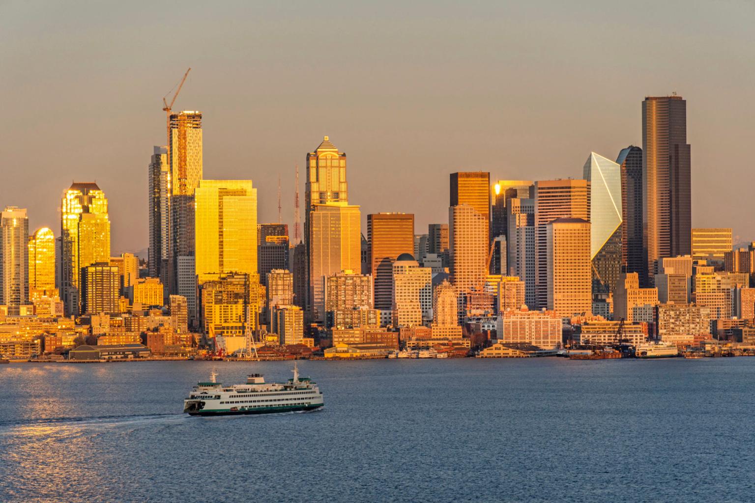 Washington State ferry crossing Elliott Bay at golden hour